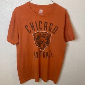 Large, orange, Chicago Bears NFL shirts.